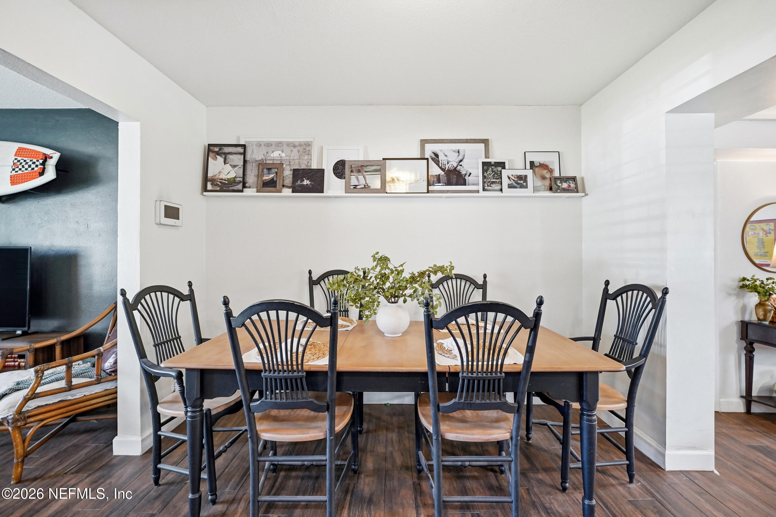 10524 Beverly Nalle Road Jacksonville, FL 32225 - Photo 7 of 28 a view of a dining room with furniture and wooden floor