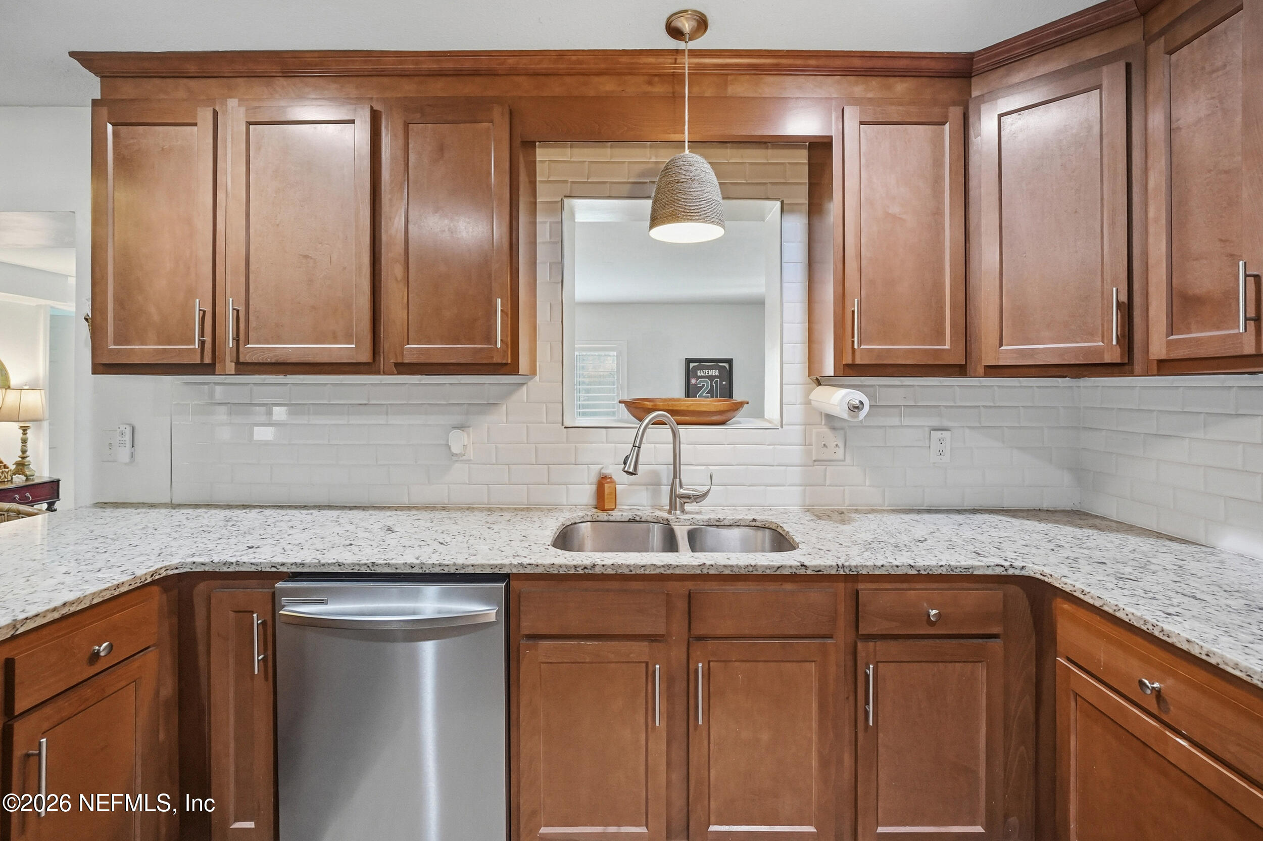 10524 Beverly Nalle Road Jacksonville, FL 32225 - Photo 10 of 28 a kitchen with granite countertop stainless steel appliances white cabinets and a sink