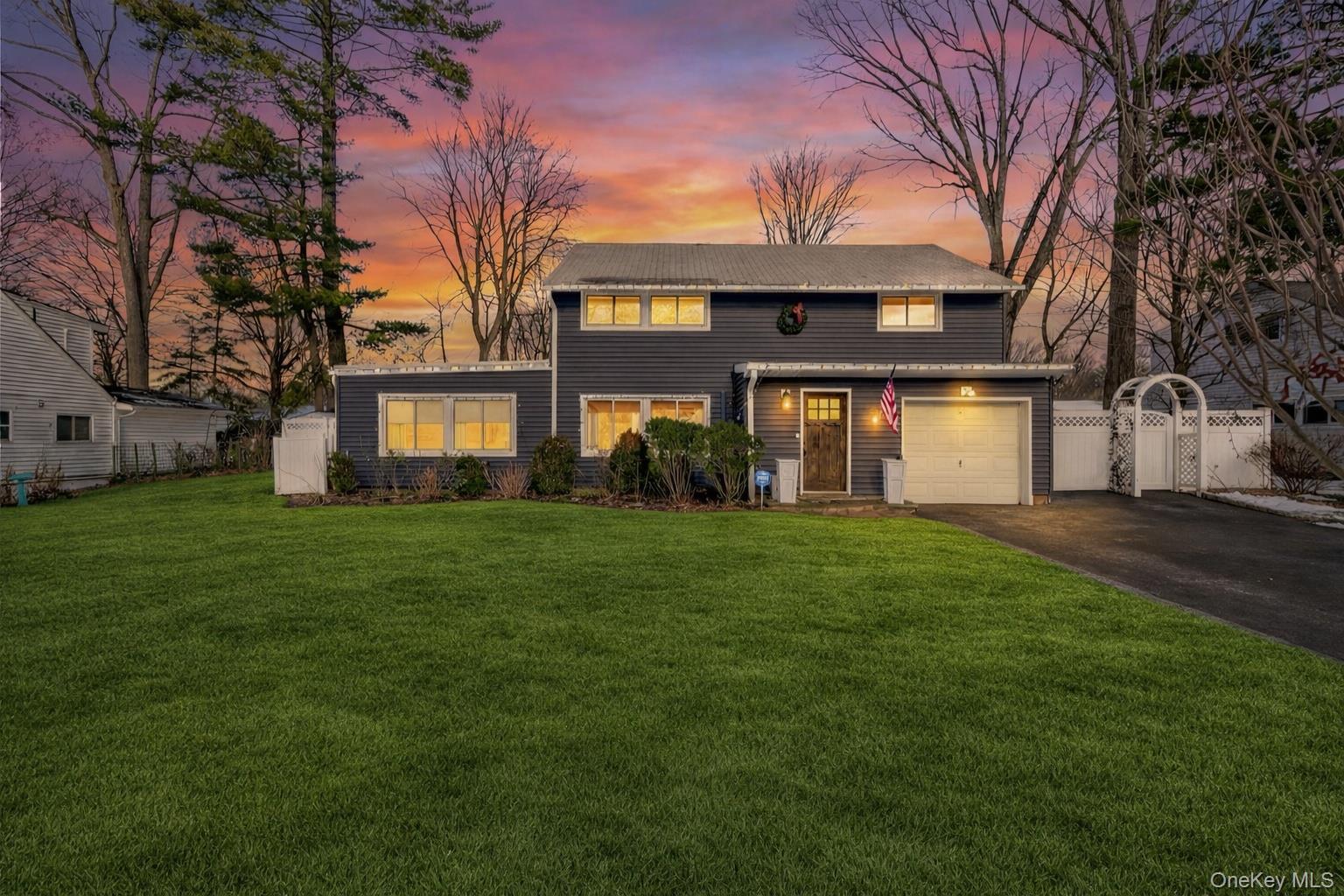 18 Lambert Lane New Rochelle, NY 10804 - Photo 2 of 47 View of front of home featuring asphalt driveway