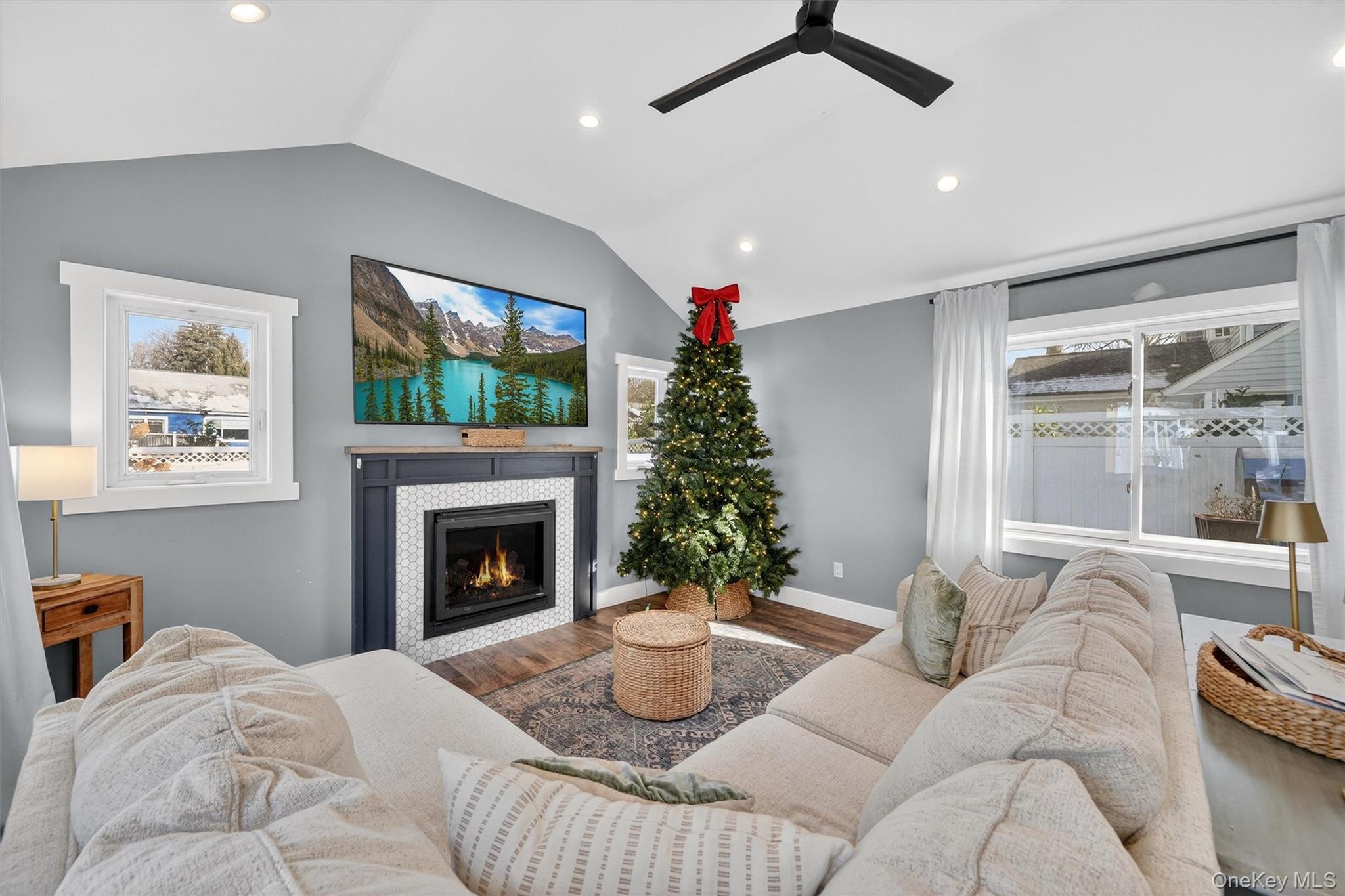 18 Lambert Lane New Rochelle, NY 10804 - Photo 21 of 47 Living area with healthy amount of natural light, a fireplace, recessed lighting, and lofted ceiling