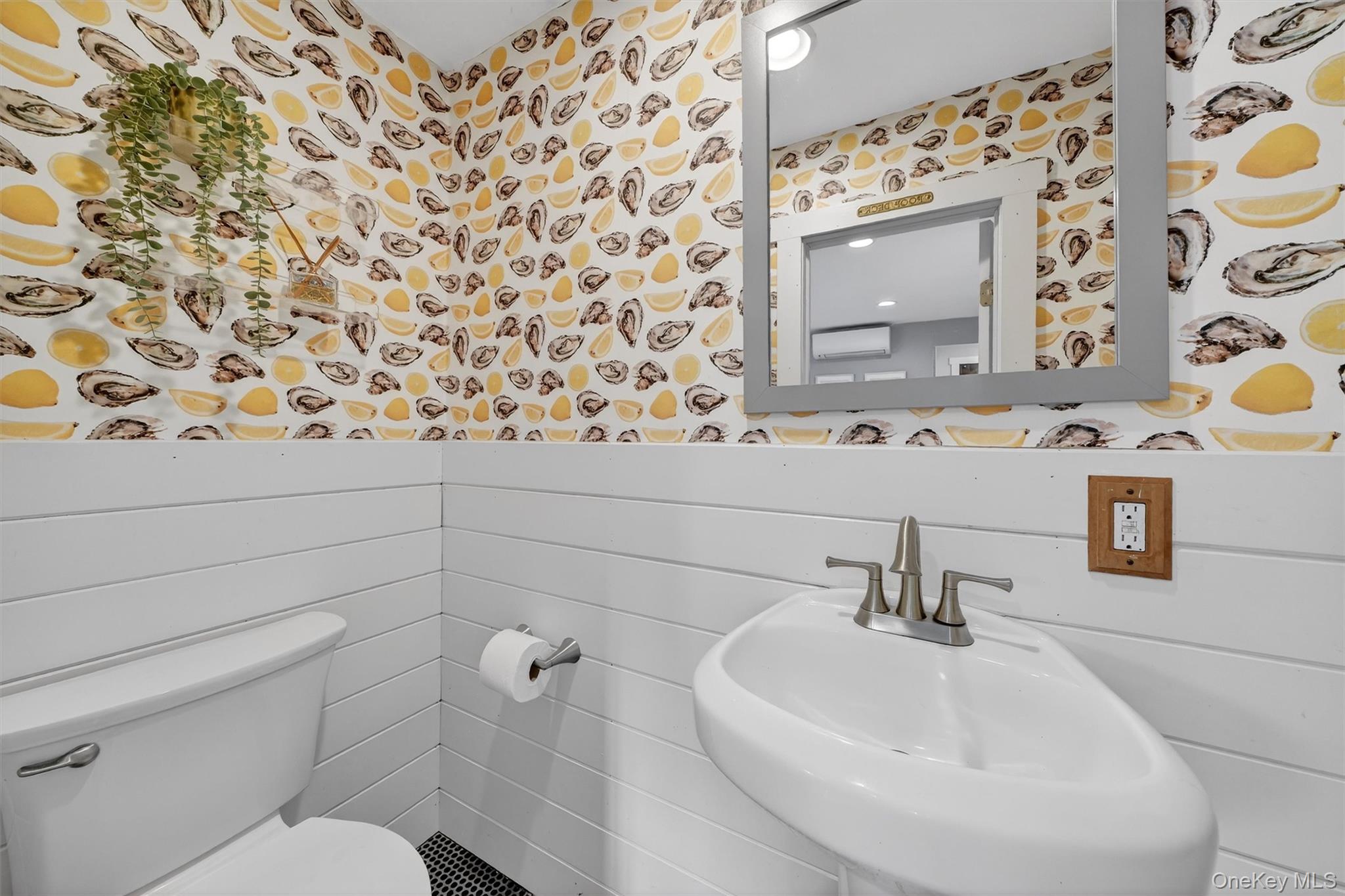 18 Lambert Lane New Rochelle, NY 10804 - Photo 27 of 47 Half Bathroom with wallpapered walls and shiplap half wall