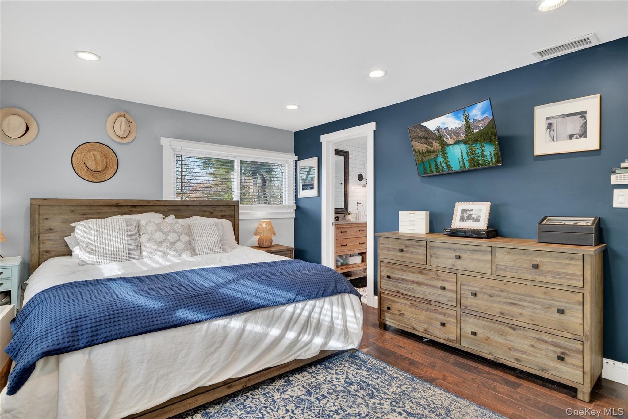 18 Lambert Lane New Rochelle, NY 10804 - Photo 30 of 47 Bedroom featuring dark wood-style flooring, recessed lighting, and ensuite bathroom