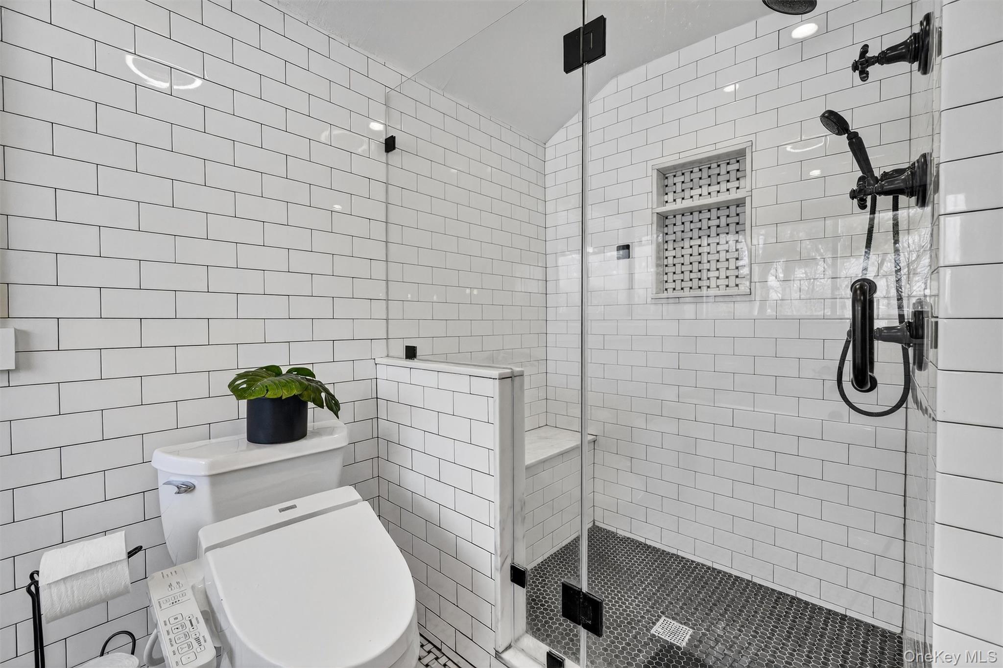 18 Lambert Lane New Rochelle, NY 10804 - Photo 33 of 47 Full bathroom featuring a stall shower and tile walls