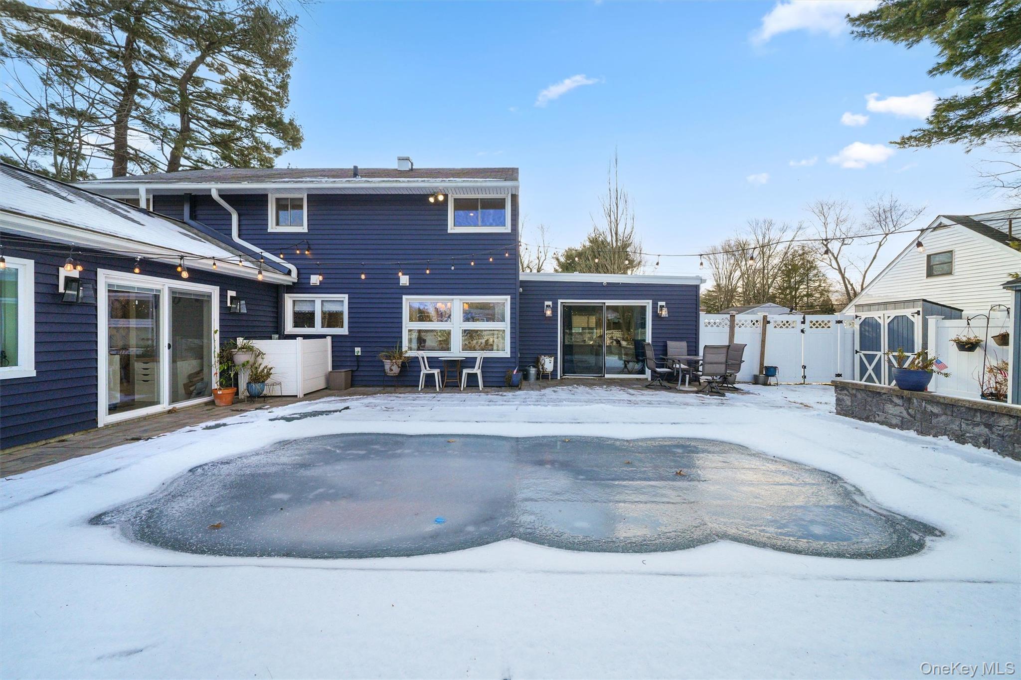 18 Lambert Lane New Rochelle, NY 10804 - Photo 42 of 47 Rear view of property featuring a patio area and a gate