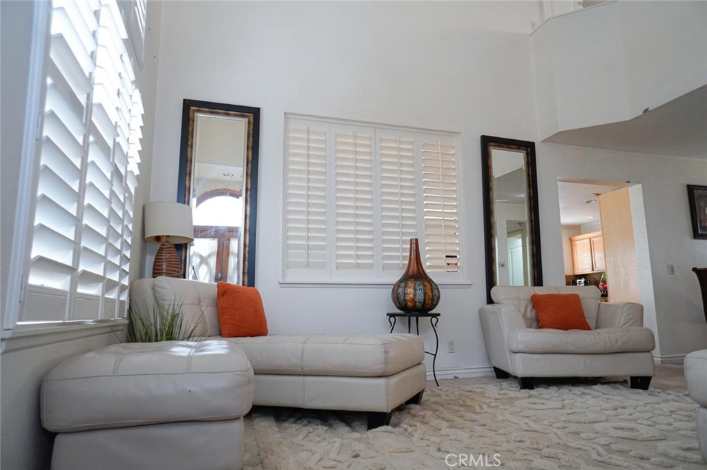 507 Lassa Way Perris, CA 92571 - Photo 12 of 36 a living room with furniture and a potted plant