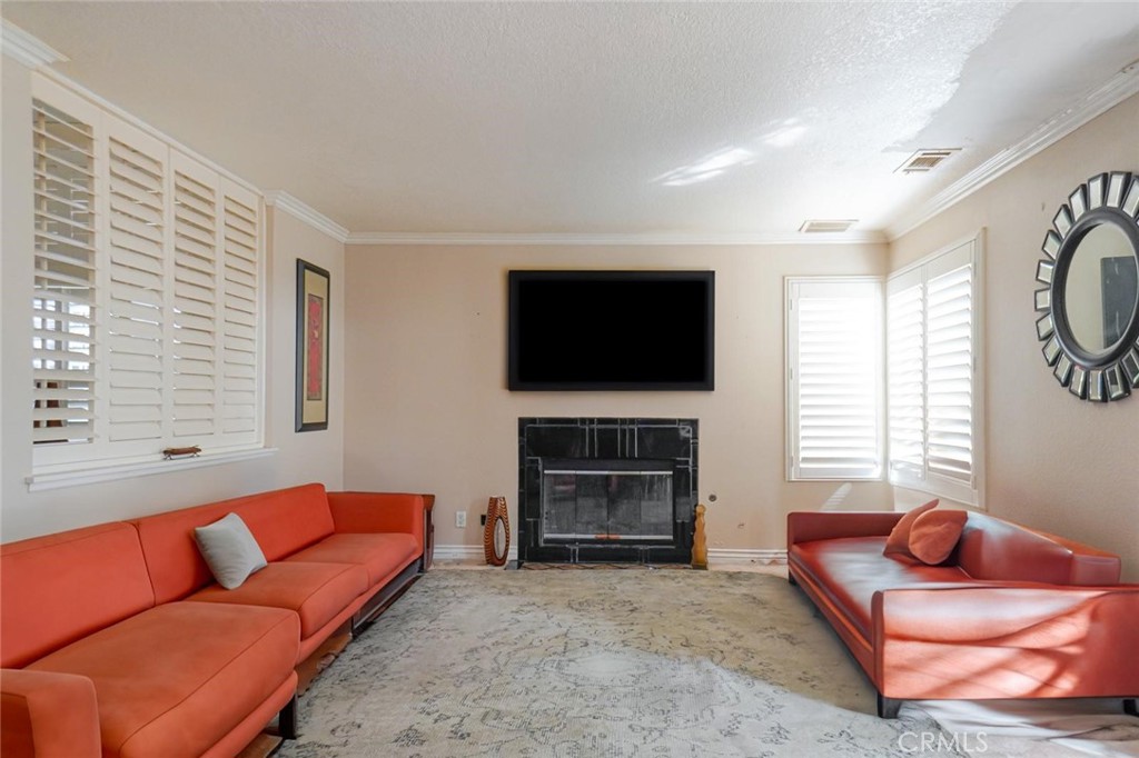 507 Lassa Way Perris, CA 92571 - Photo 15 of 36 a living room with furniture and a flat screen tv