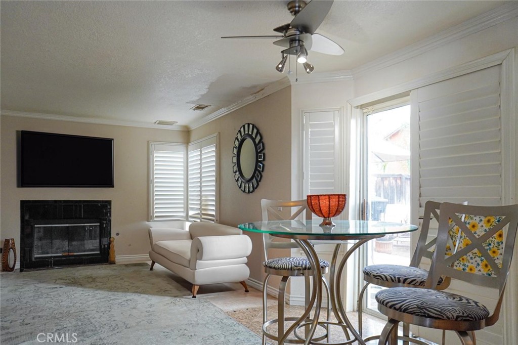 507 Lassa Way Perris, CA 92571 - Photo 20 of 36 a living room with furniture a flat screen tv and a fireplace