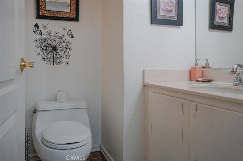 507 Lassa Way Perris, CA 92571 - Photo 22 of 36 a white toilet sitting next to a bathroom sink