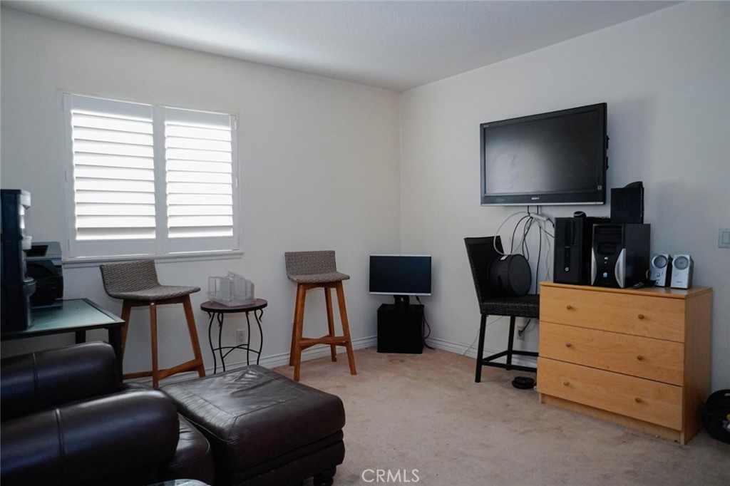 507 Lassa Way Perris, CA 92571 - Photo 24 of 36 a view of a livingroom with workspace and a window