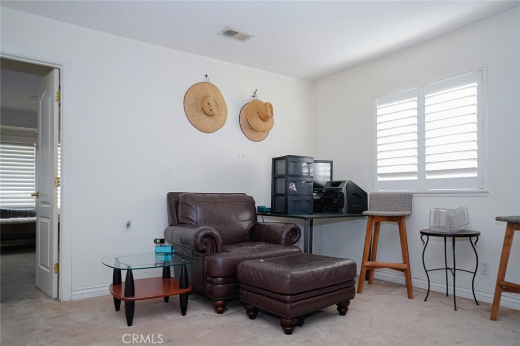 507 Lassa Way Perris, CA 92571 - Photo 26 of 36 a living room with furniture a air conditioner and a window