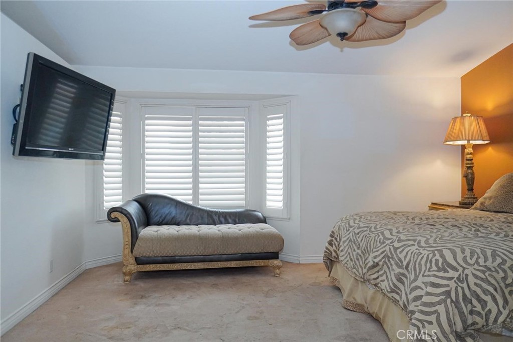 507 Lassa Way Perris, CA 92571 - Photo 27 of 36 a bedroom with a bed couch and window