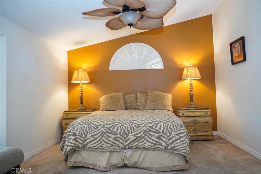 507 Lassa Way Perris, CA 92571 - Photo 32 of 36 a bedroom with a bed and a painting on the wall