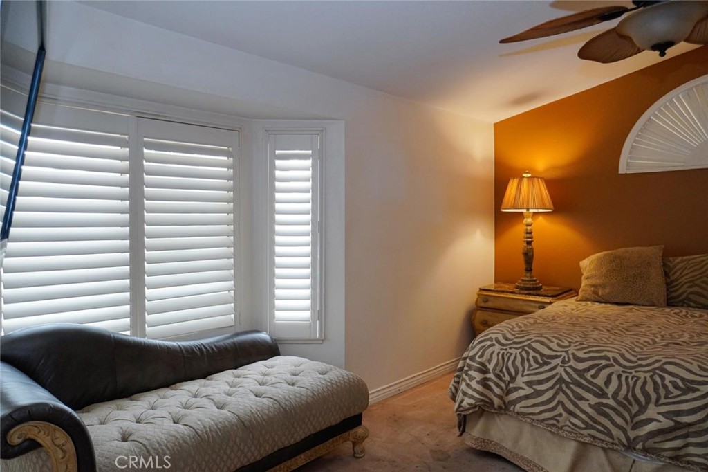 507 Lassa Way Perris, CA 92571 - Photo 33 of 36 a bedroom with a bed and a night stand