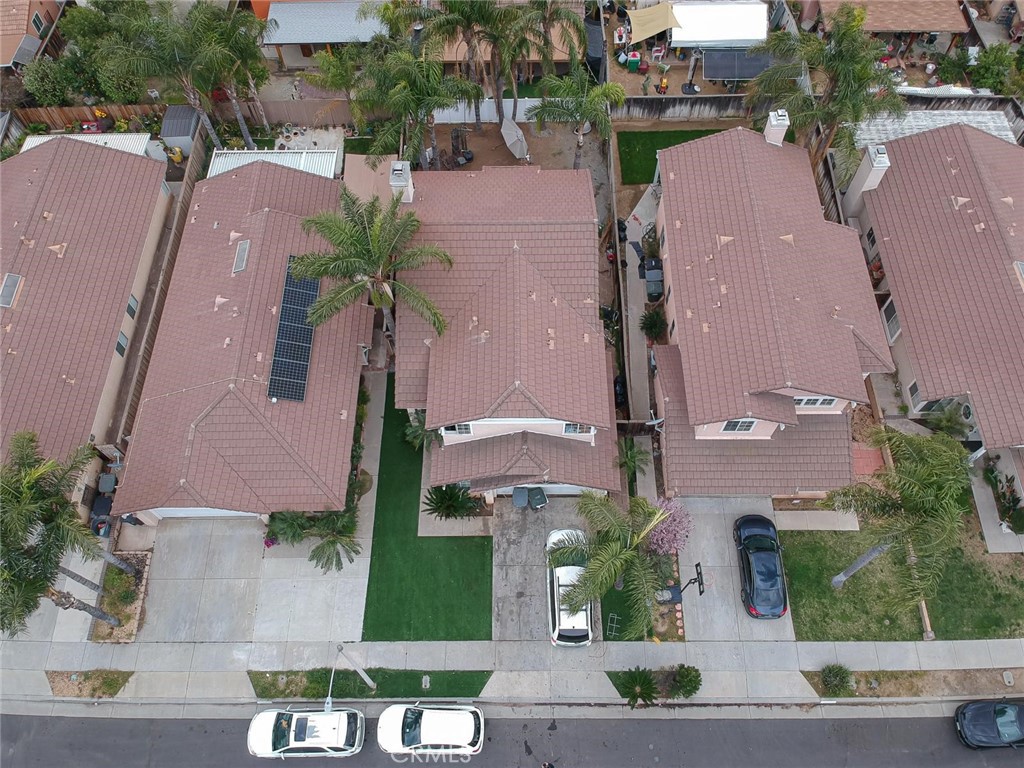 507 Lassa Way Perris, CA 92571 - Photo 4 of 36 an aerial view of multiple houses with a yard