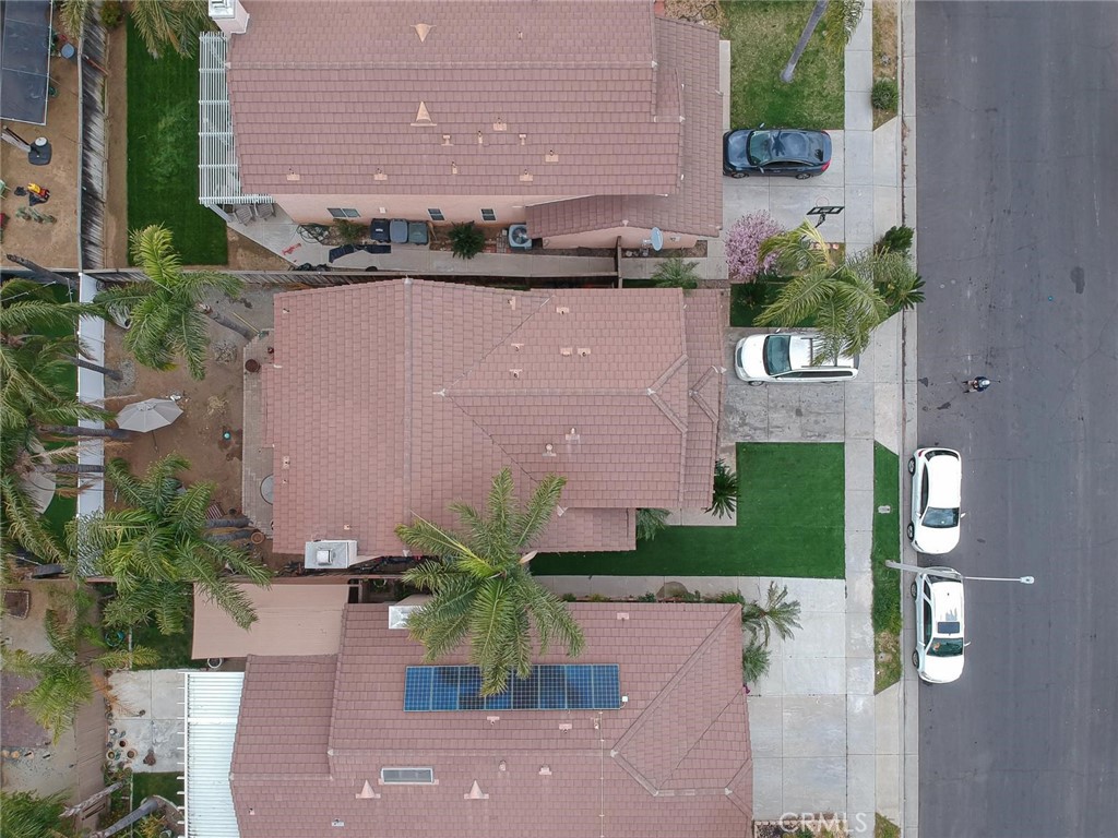 507 Lassa Way Perris, CA 92571 - Photo 5 of 36 an aerial view of a house with a yard and a fountain