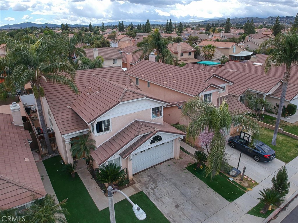 507 Lassa Way Perris, CA 92571 - Photo 6 of 36 an aerial view of a house with a garden