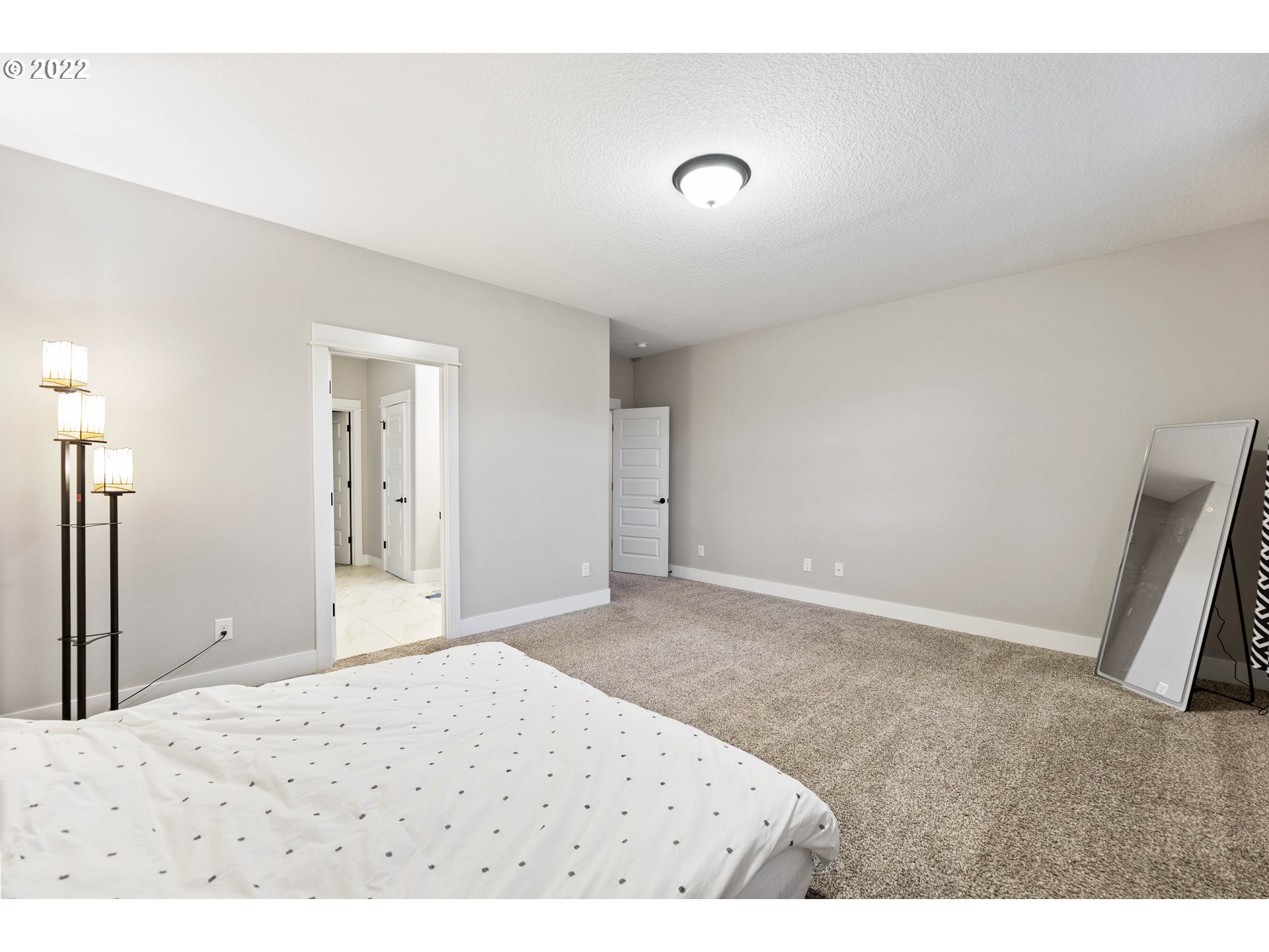 4616 South 16th Drive Ridgefield, WA 98642 - Photo 13 of 28 a view of a big room with closet and wooden floor