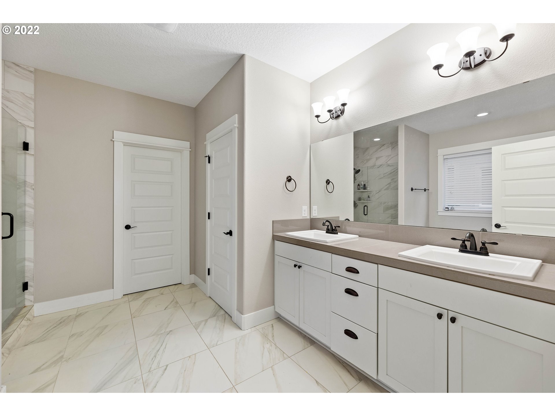 4616 South 16th Drive Ridgefield, WA 98642 - Photo 14 of 28 a spacious bathroom with a granite countertop sink mirror and a