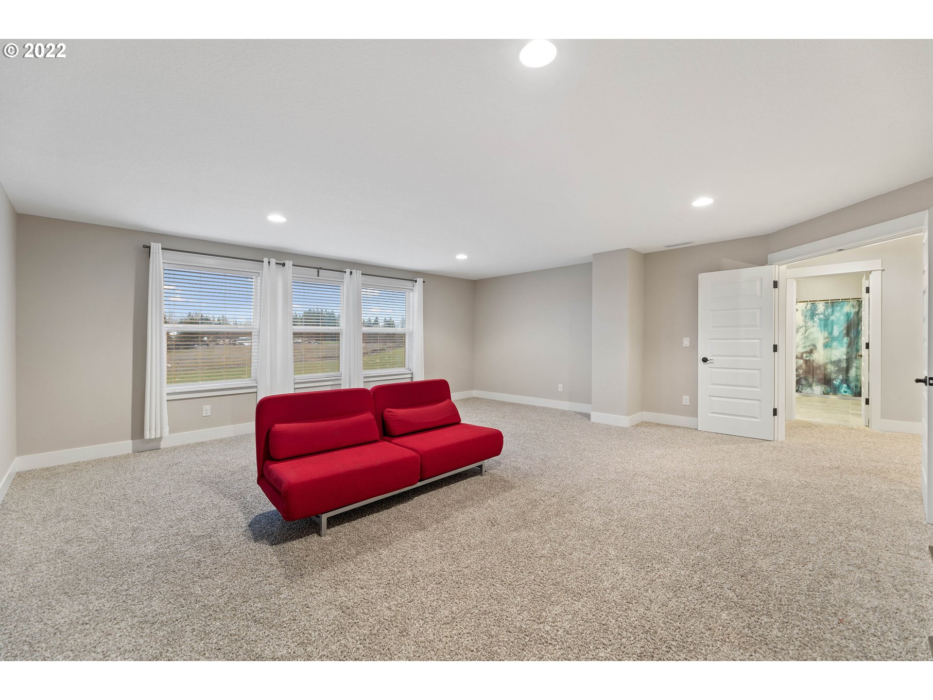 4616 South 16th Drive Ridgefield, WA 98642 - Photo 23 of 28 a living room with furniture and a large window