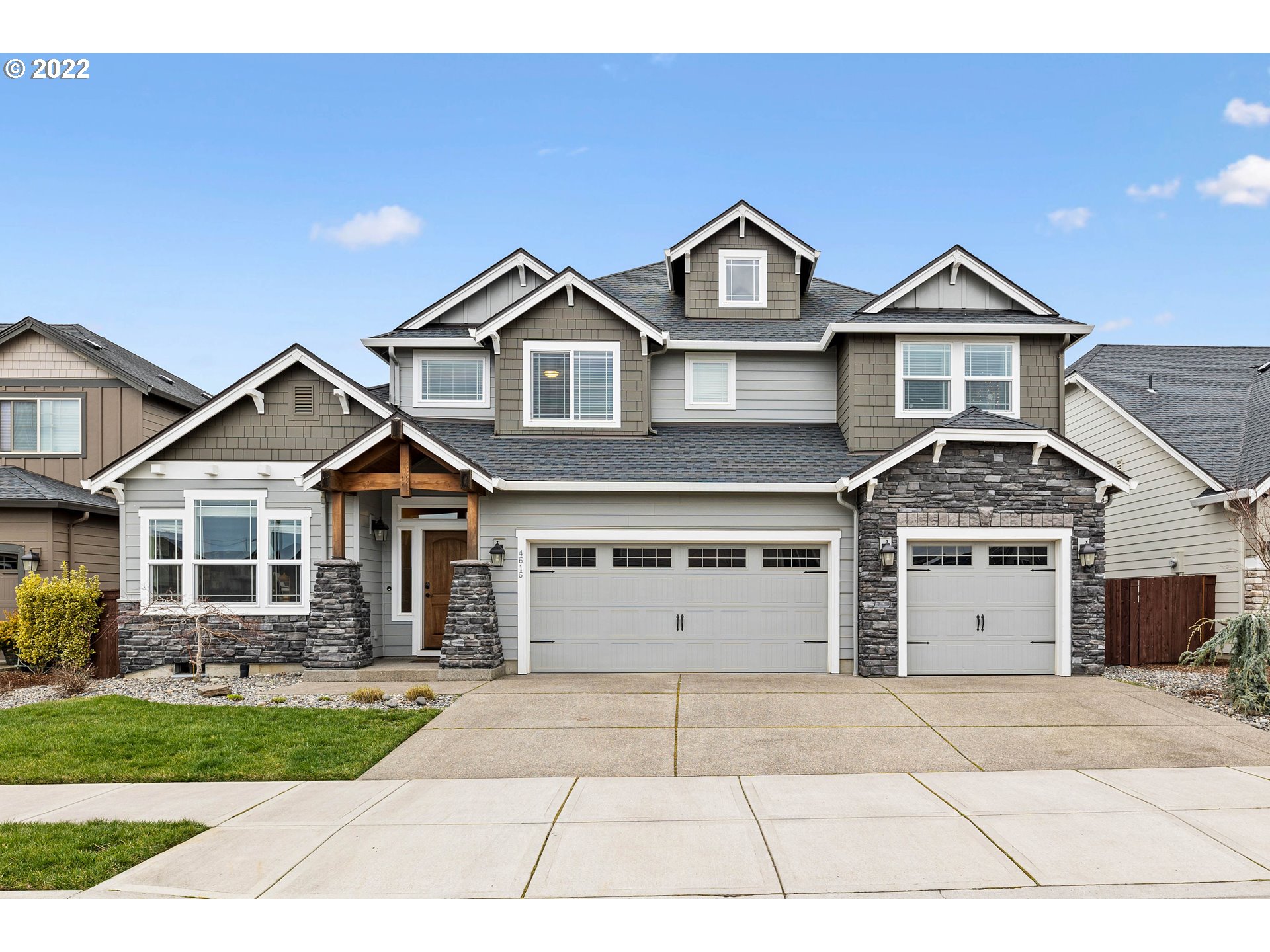 4616 South 16th Drive Ridgefield, WA 98642 - Photo 24 of 28 a front view of a house with a yard and garage