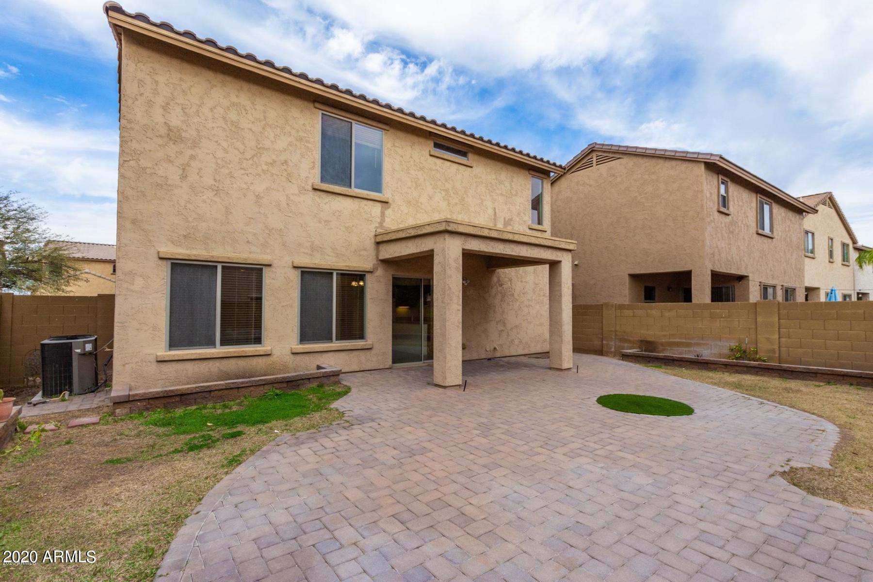 2023 West Davis Road Phoenix, AZ 85023 - Photo 11 of 16 a view of a house with a yard