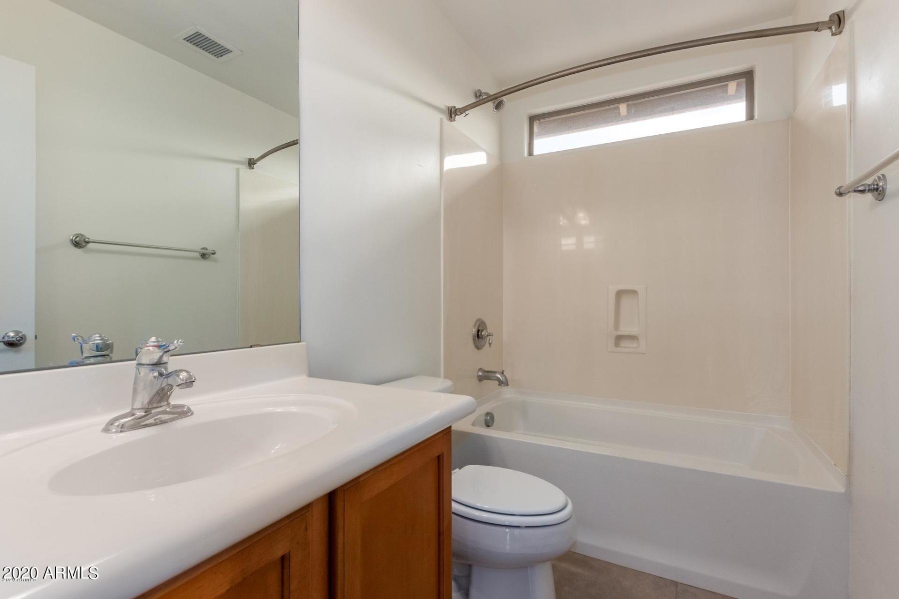 2023 West Davis Road Phoenix, AZ 85023 - Photo 7 of 16 a bathroom with a sink toilet and shower