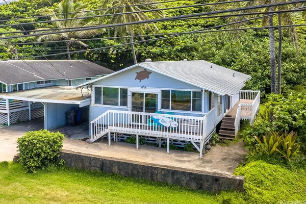 a house with swimming pool in front of it