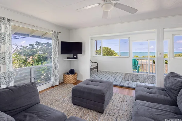 a living room with furniture and a flat screen tv