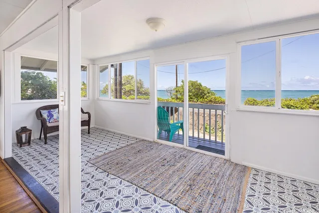 a view of an entryway with wooden floor