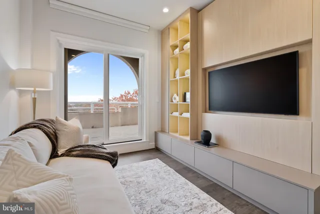 a living room with furniture and a lamp