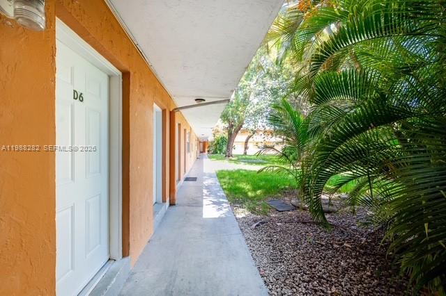 9760 Southwest 184th Street, Unit 6D Cutler Bay, FL 33157 - Photo 1 of 16 a view of a back yard from a corridor