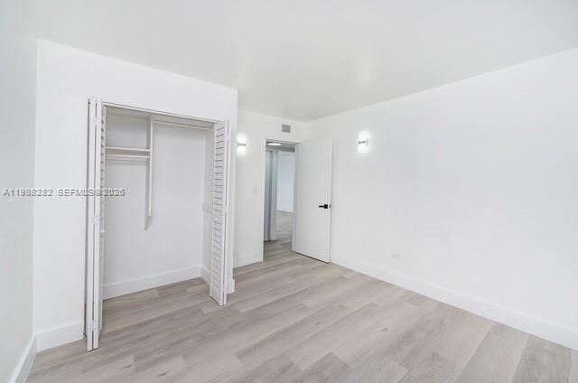 9760 Southwest 184th Street, Unit 6D Cutler Bay, FL 33157 - Photo 12 of 16 wooden floor in an empty room