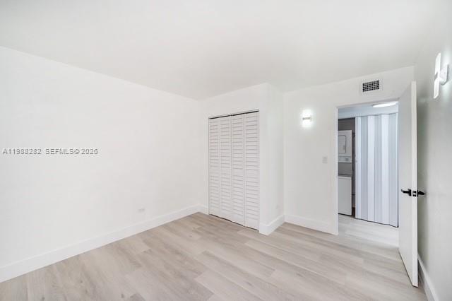 9760 Southwest 184th Street, Unit 6D Cutler Bay, FL 33157 - Photo 13 of 16 an empty room with wooden floor and window