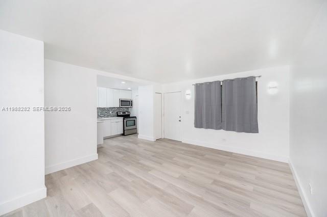 9760 Southwest 184th Street, Unit 6D Cutler Bay, FL 33157 - Photo 7 of 16 a view of a kitchen with an empty space and a window