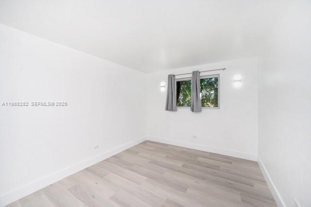 9760 Southwest 184th Street, Unit 6D Cutler Bay, FL 33157 - Photo 9 of 16 an empty room with a window