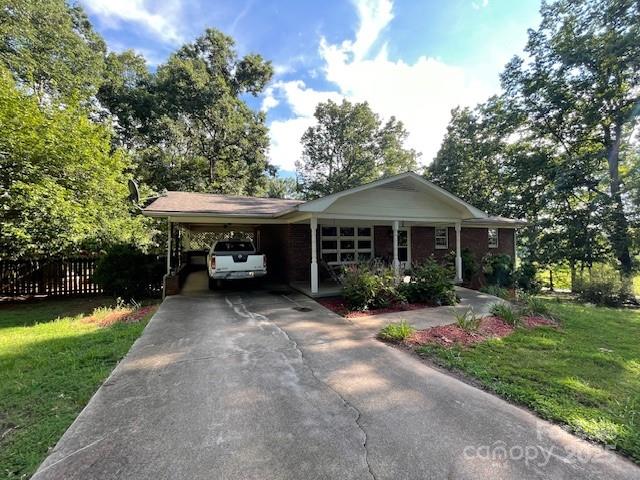 126 Waters Road Bostic, NC 28018 - Photo 1 of 29 a front view of house with yard and green space