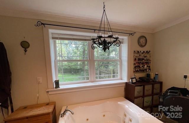 126 Waters Road Bostic, NC 28018 - Photo 14 of 29 a bathroom with a window and a chandelier