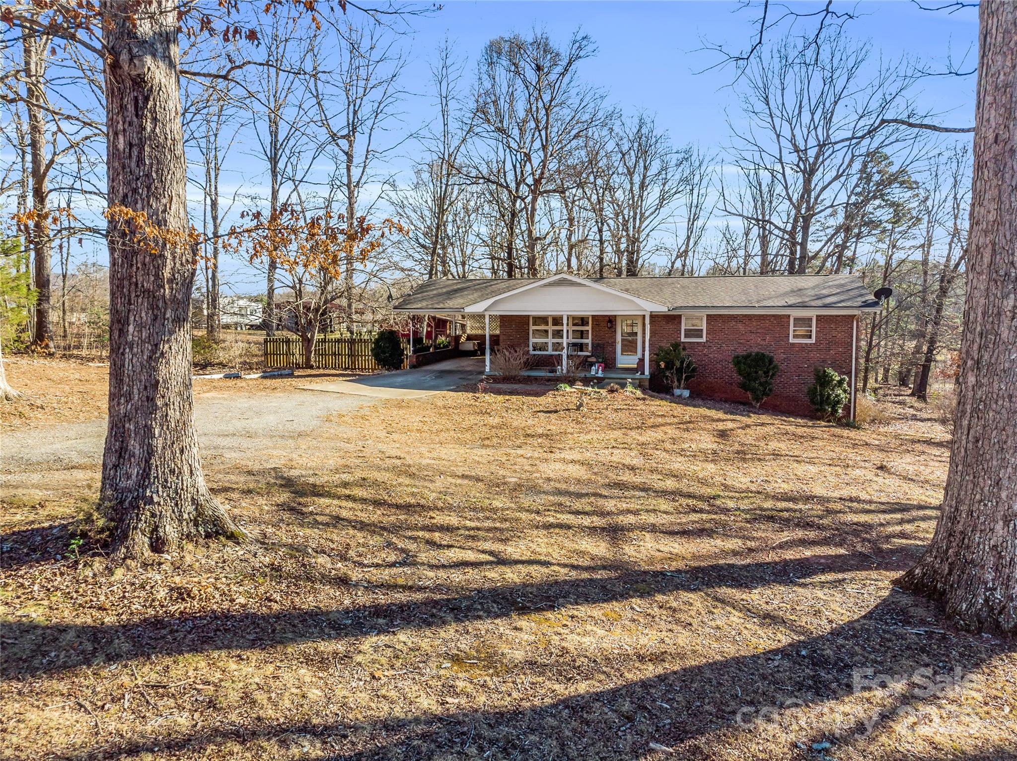 126 Waters Road Bostic, NC 28018 - Photo 27 of 29 a view of a house with snow on the side of the road