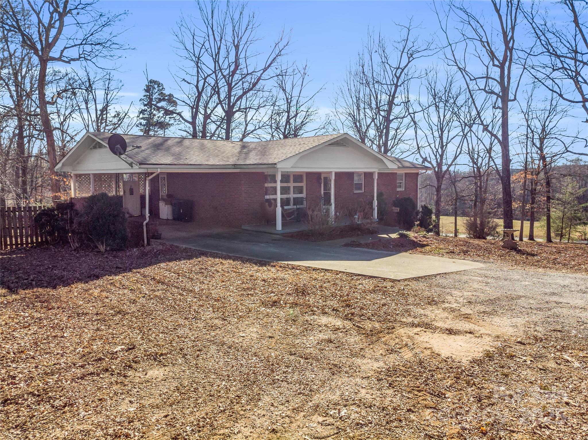 126 Waters Road Bostic, NC 28018 - Photo 28 of 29 a front view of a house with a yard covered in snow