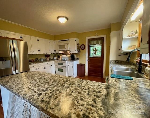 126 Waters Road Bostic, NC 28018 - Photo 4 of 29 a kitchen with stainless steel appliances granite countertop a refrigerator and a stove top oven
