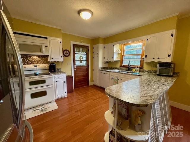 126 Waters Road Bostic, NC 28018 - Photo 6 of 29 a kitchen with stainless steel appliances kitchen island granite countertop a stove a sink and a refrigerator