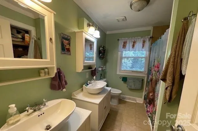 a bathroom with a sink mirror and toilet