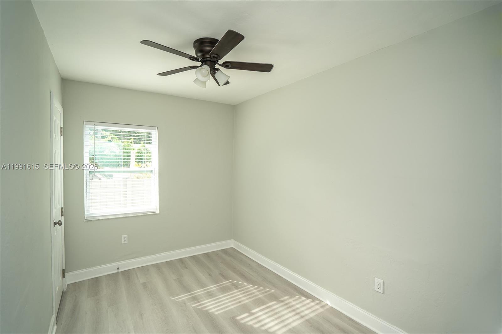 2230 Southwest 60th Court Miami, FL 33155 - Photo 30 of 35 a view of a big room with windows and chandelier fan