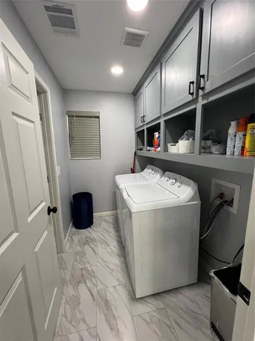 a view of kitchen with furniture and wooden floor