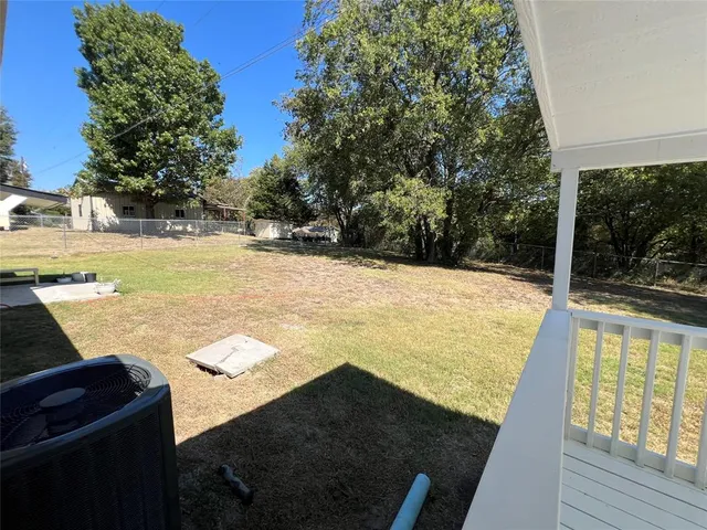 a view of swimming pool from a yard