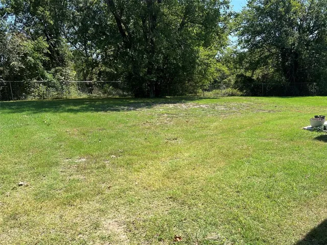 a view of outdoor space with deck and yard