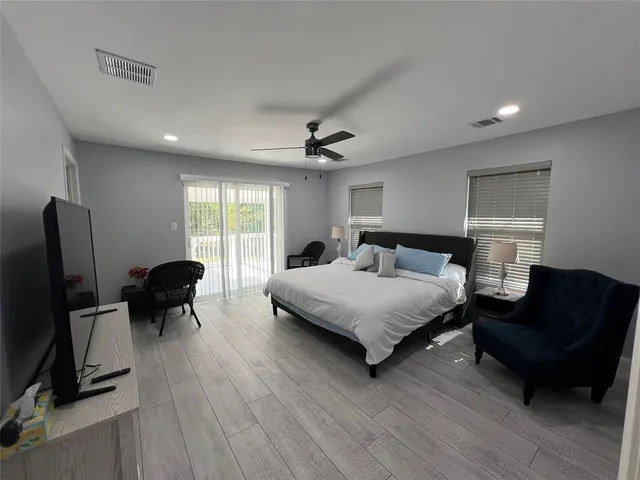 a bedroom with furniture and a window