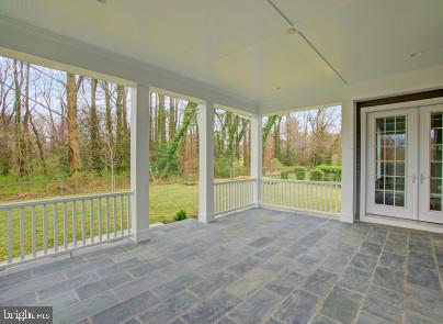 2025 Kilgore Road Falls Church, VA 22043 - Photo 3 of 33 Stone covered porch of the kitchen overlooks woods