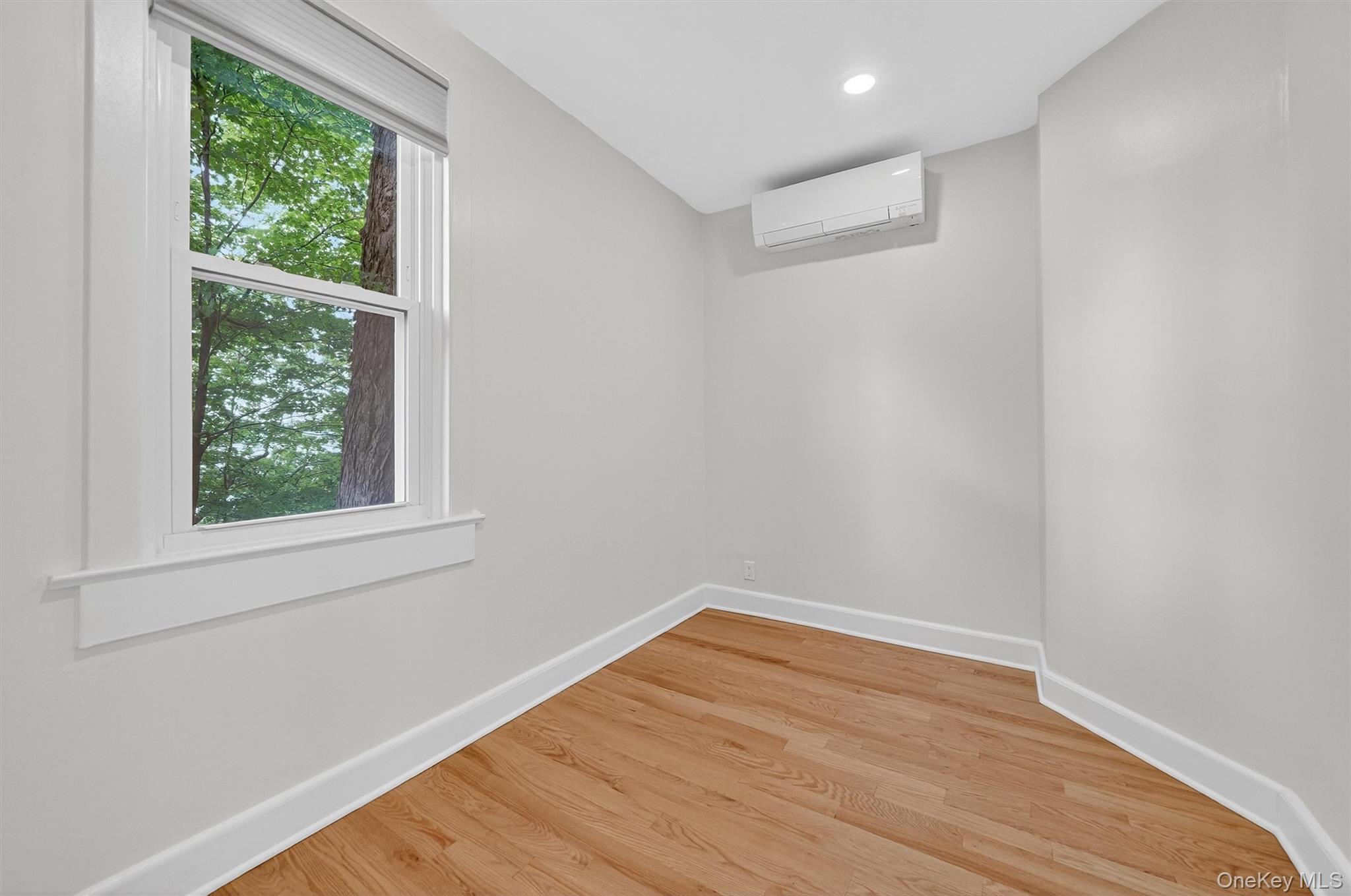 79 Main Street, Unit 2W Ossining, NY 10562 - Photo 12 of 17 Bedroom with gleaming hardwood floors.