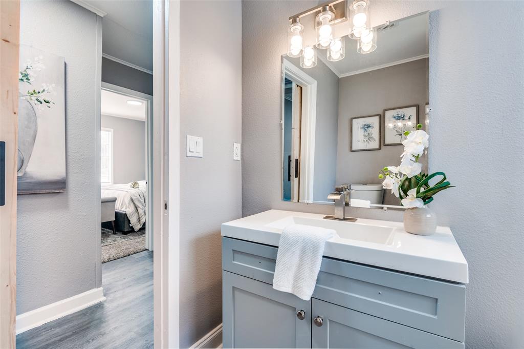 421 West 8th Street Lancaster, TX 75146 - Photo 13 of 28 Vanity with a white countertop and integrated rectangular sink